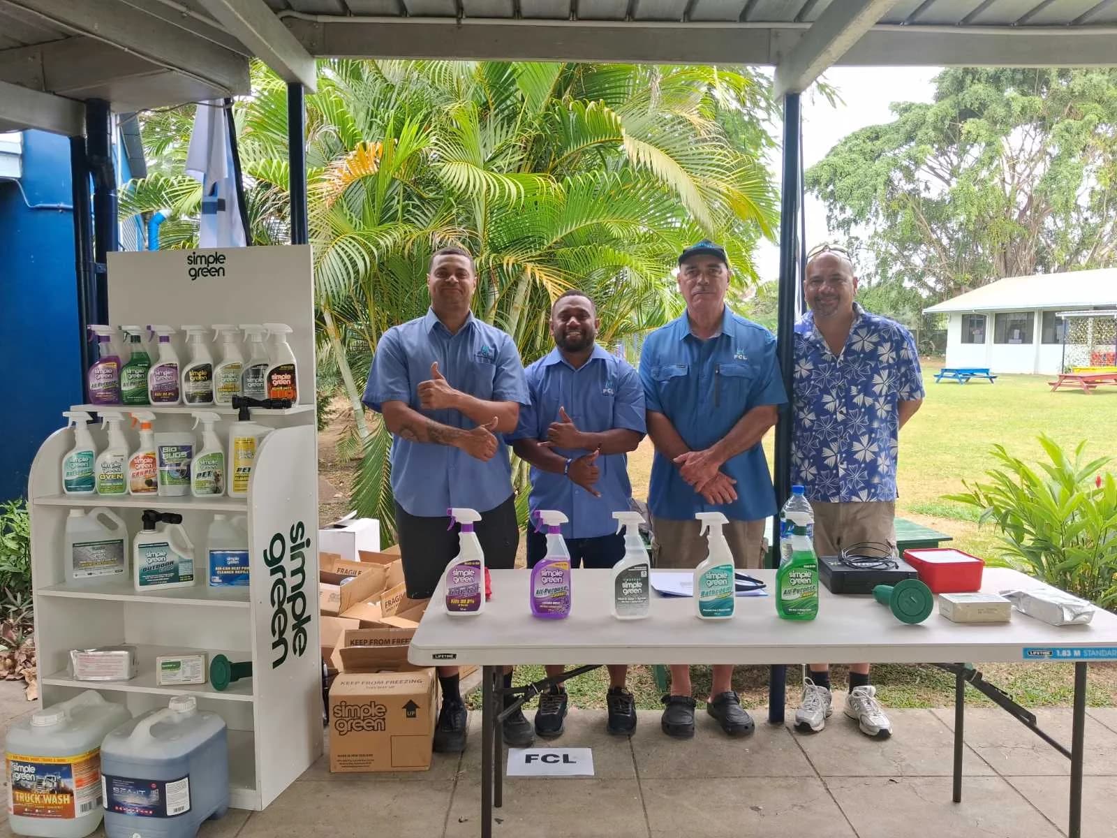 Fiji Chemicals team beside a display of Simple Green cleaning products