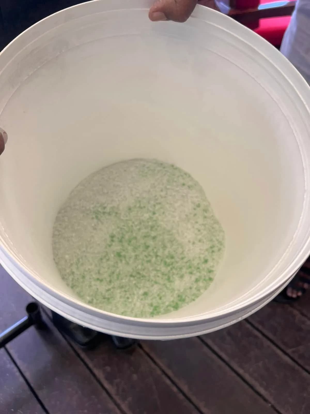A bucket of crushed glass from the recycling programme