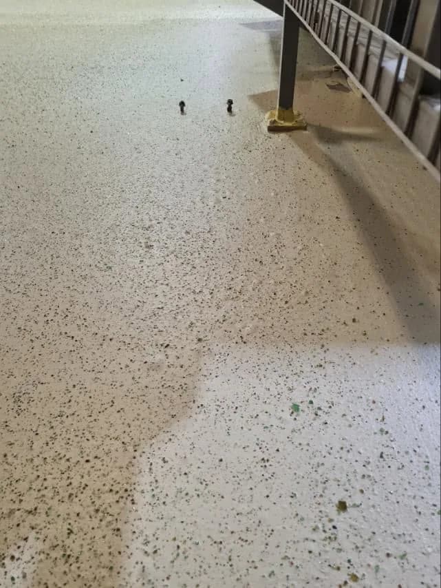 Close-up of recycled-glass aggregate in a finished floor